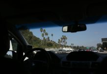 What Drivers Should Know About Minimum Coverage Requirements in San Diego A view of a highway from inside a car