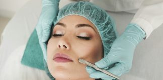 woman doing liposuction on her face