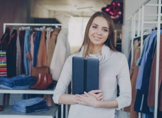 Successful Marketing Strategies for Retail Store Owners A woman stands in a clothing store.