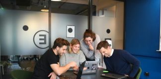 people sitting on chair in front of laptop computers