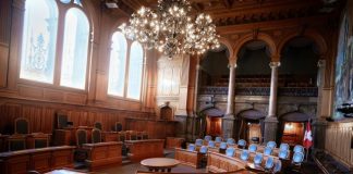 a large room with chairs and a chandelier