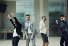 Tips for Dressing for Your Office Holiday Party Business people celebrating and dancing in office