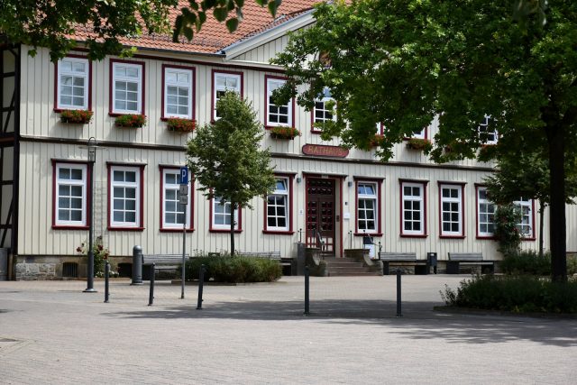 Photo by Ries Bosch Traditional timber-framed building with white windows.