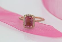 A Rosé That Lasts Forever gold and silver ring on pink textile