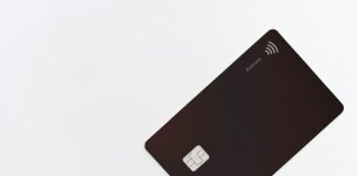 black asus laptop computer on white surface