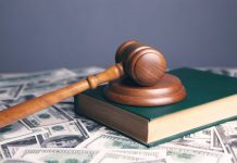 How Can You Afford to Hire a Lawyer When You’re Broke? brown wooden chess piece on brown book