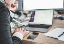 QA Outsourcing: When It Makes Sense and How to Do It Effectively black iPhone near MacBook Pro