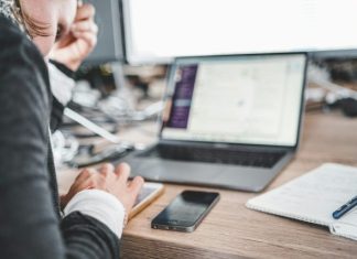 QA Outsourcing: When It Makes Sense and How to Do It Effectively black iPhone near MacBook Pro