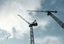 Constructing Clicks into Real Leads black crane under cloudy sky during daytime