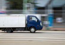 What Are The Leading Causes of Commercial Truck Accidents in Texas? blue and white van on road during daytime