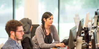 unknown persons using computer indoors