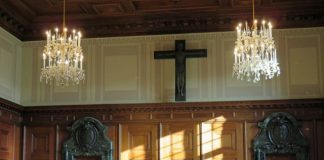 black cross on brown wooden table