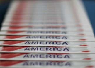 Hidden Obstacles Threatening the Future of Voting in the U.S. white and red lined paper