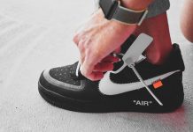 person wearing black and white nike air force 1 high