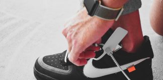 person wearing black and white nike air force 1 high