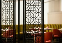 Restaurant Chairs That Enhance Comfort and Style for Every Dining Area A room divider in a restaurant with red chairs