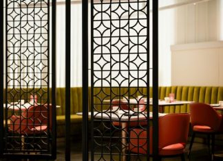 Restaurant Chairs That Enhance Comfort and Style for Every Dining Area A room divider in a restaurant with red chairs