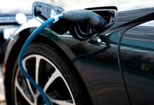 an electric car plugged in to a charger