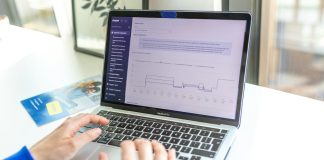 a person using a laptop computer on a desk