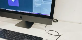 silver imac beside apple magic keyboard and apple magic mouse