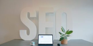 a laptop computer sitting on top of a desk
