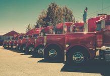 red and black vintage car on road during daytime