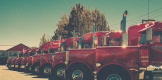red and black vintage car on road during daytime