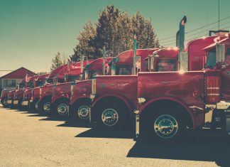 red and black vintage car on road during daytime