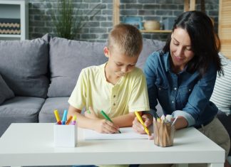 How Experts Tailor Personalized ABA Therapy for Individual Needs Mother and son drawing together at a table.
