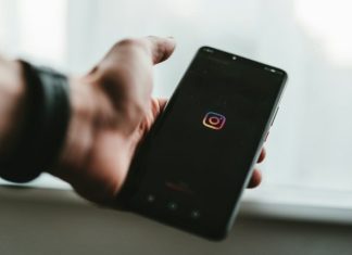 How FollowSpy Tracks Instagram Activity in Real Time person holding black android smartphone