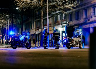 a group of motorcycles parked on the side of a road