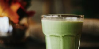 green liquid in clear drinking glass