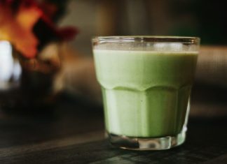 green liquid in clear drinking glass