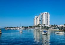 Which Holds Better Value, Bangkok Riverfront Condos or Prime Inner-City Units A body of water with a bunch of boats in it