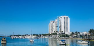 A body of water with a bunch of boats in it