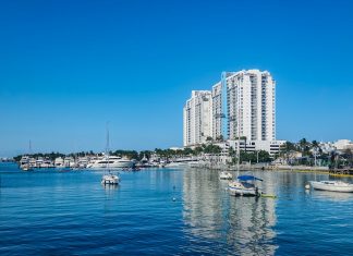 A body of water with a bunch of boats in it