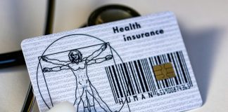 a card with a picture of a man on it next to a stethos