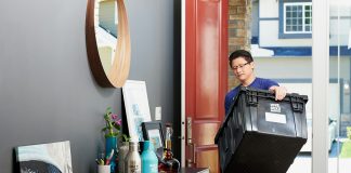 man in blue polo shirt sitting on chair