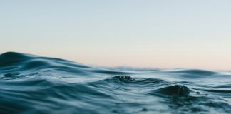 body of water under sky