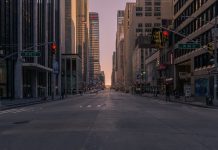 gray concrete road between buildings