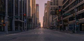 gray concrete road between buildings
