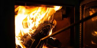 a close up of a fire burning in a stove