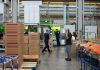 Simple Warehouse Management Tips for Beginners man in gray shirt standing beside brown cardboard boxes