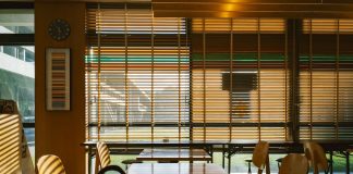 Interior view of a cafe with tables and chairs.