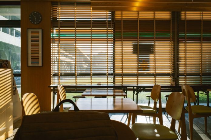 Interior view of a cafe with tables and chairs.