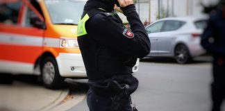 a police officer talking on a cell phone