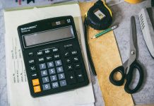 Calculator and office supplies on a desk.