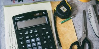 Calculator and office supplies on a desk.