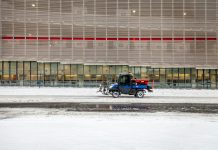 black motorcycle parked on snow covered ground