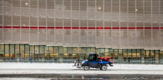 black motorcycle parked on snow covered ground